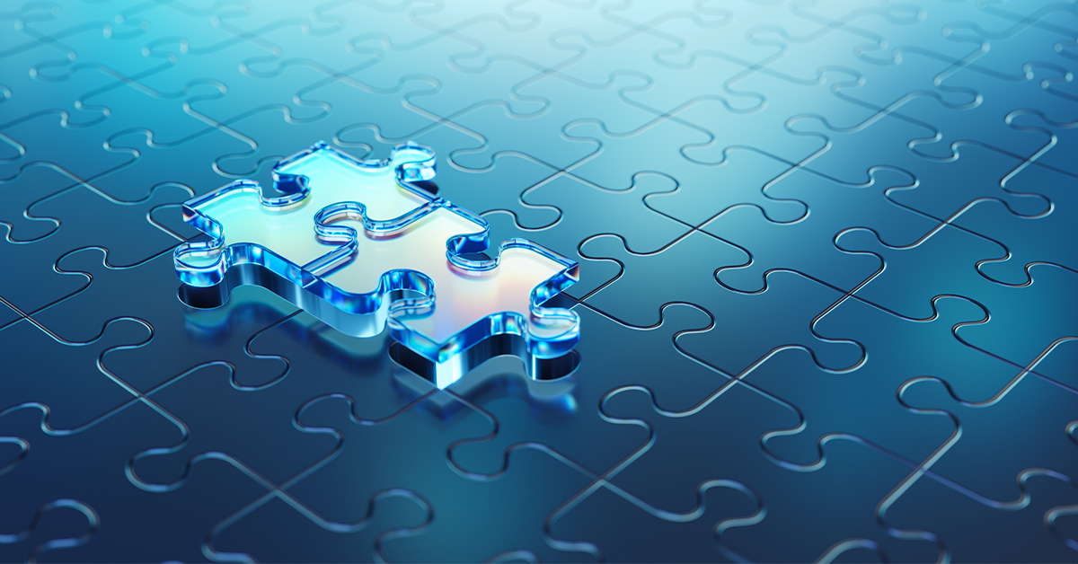 A puzzle piece on top of other puzzle pieces.