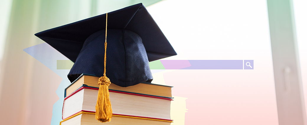 A graduation cap on top of a stack of books