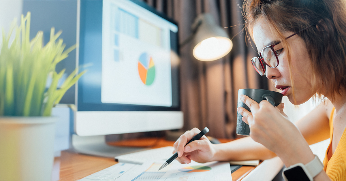 Woman looking at financial statement computer