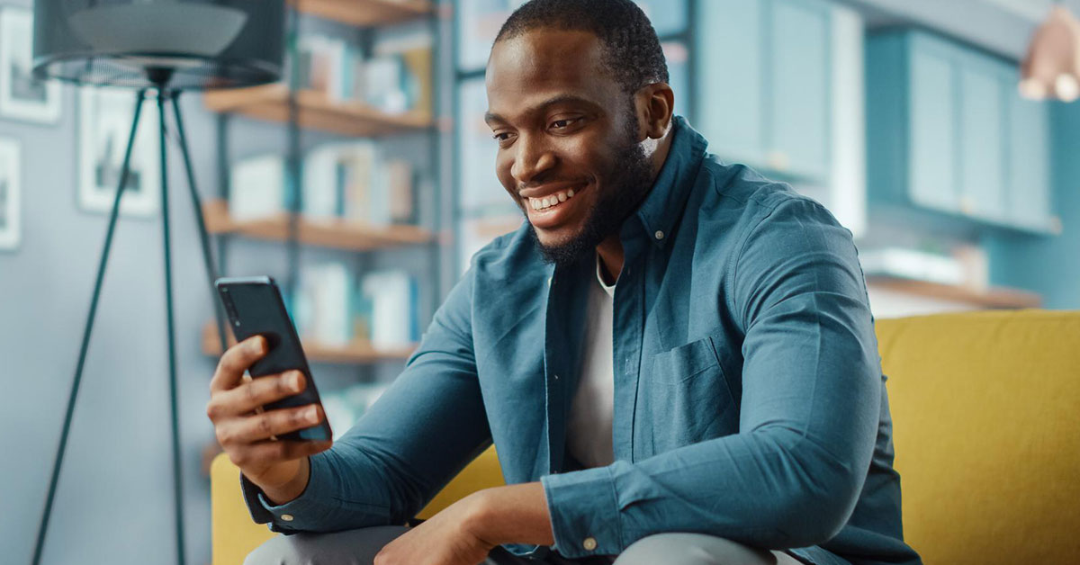 Photo of man looking at his phone