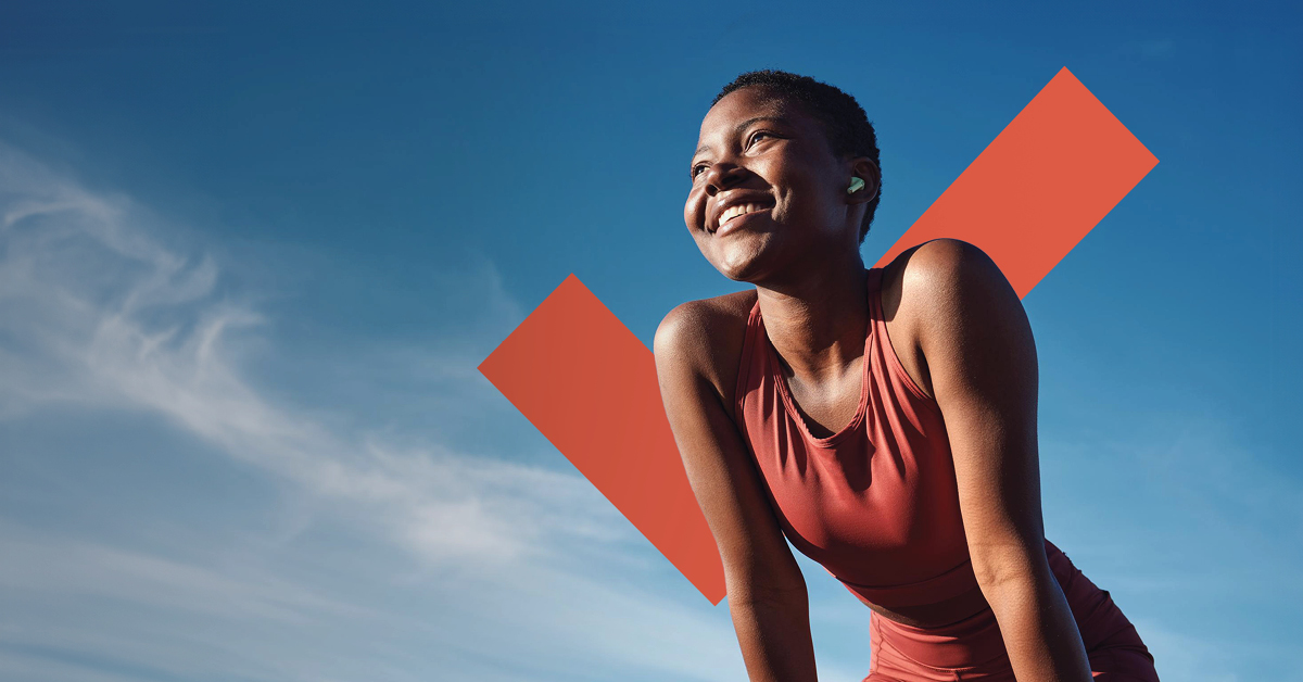 Woman smiling with sky background and checkmark