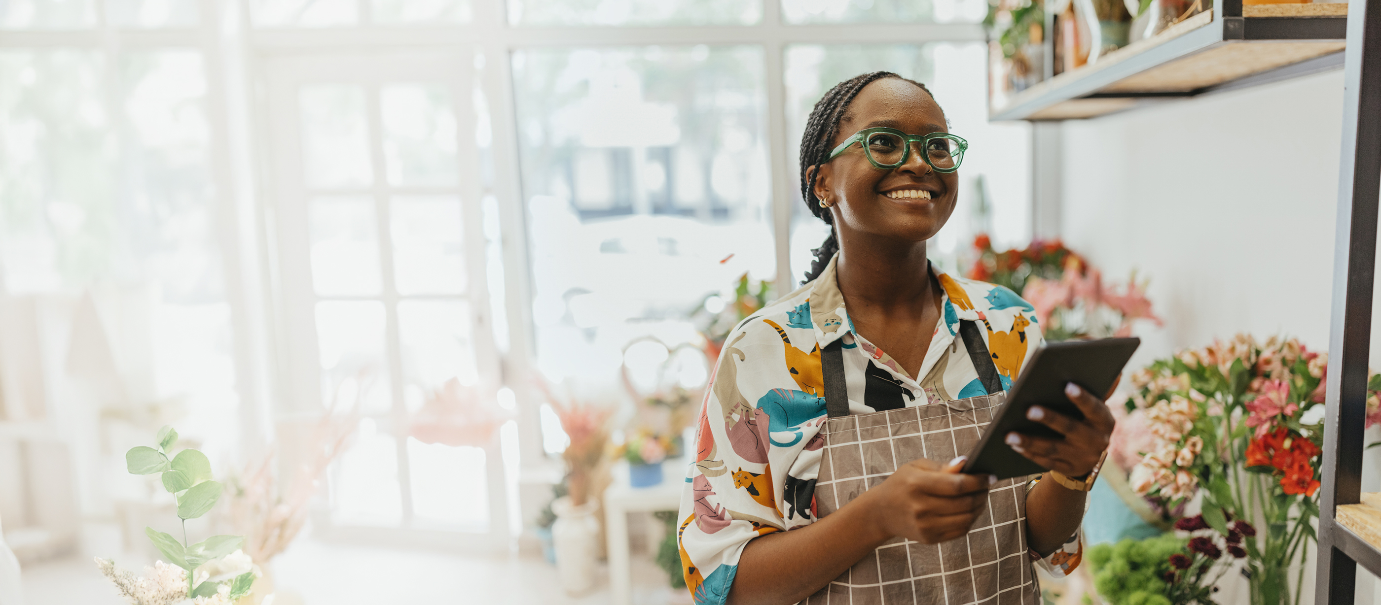 Woman smiling and holding clipboard
