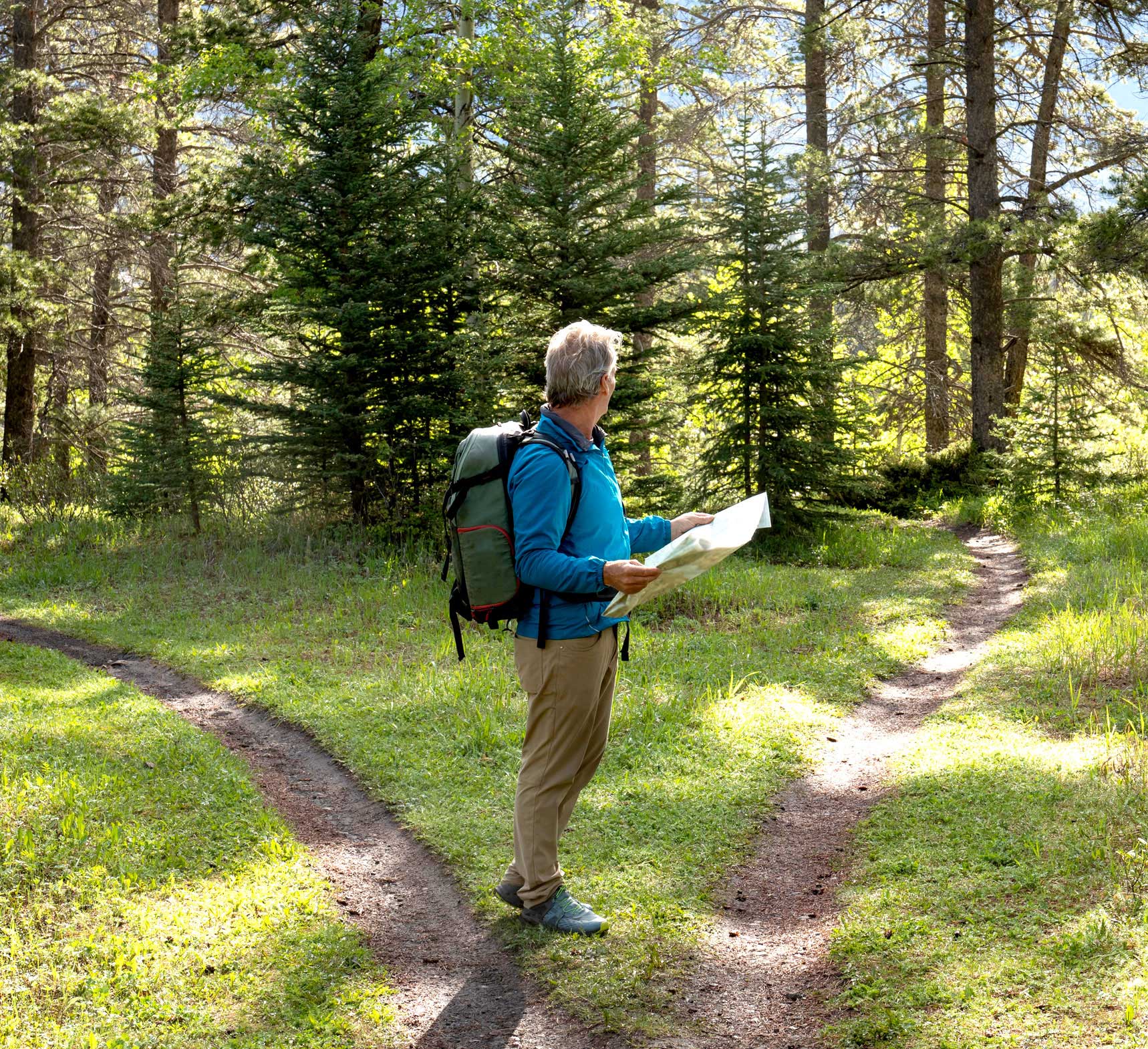 A man and woman walk with a young boy on a grassy path, surrounded by vibrant greenery in a calm and peaceful environment.